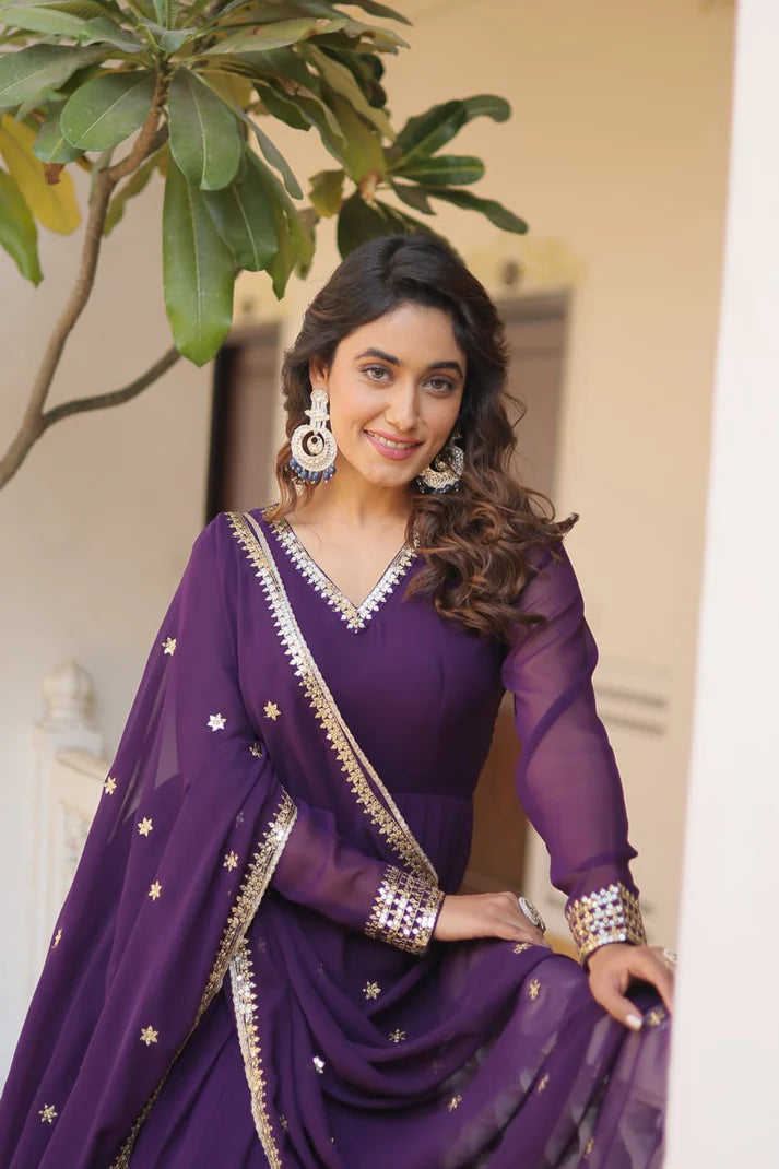 Women embroideried georgette gown with net dupatta